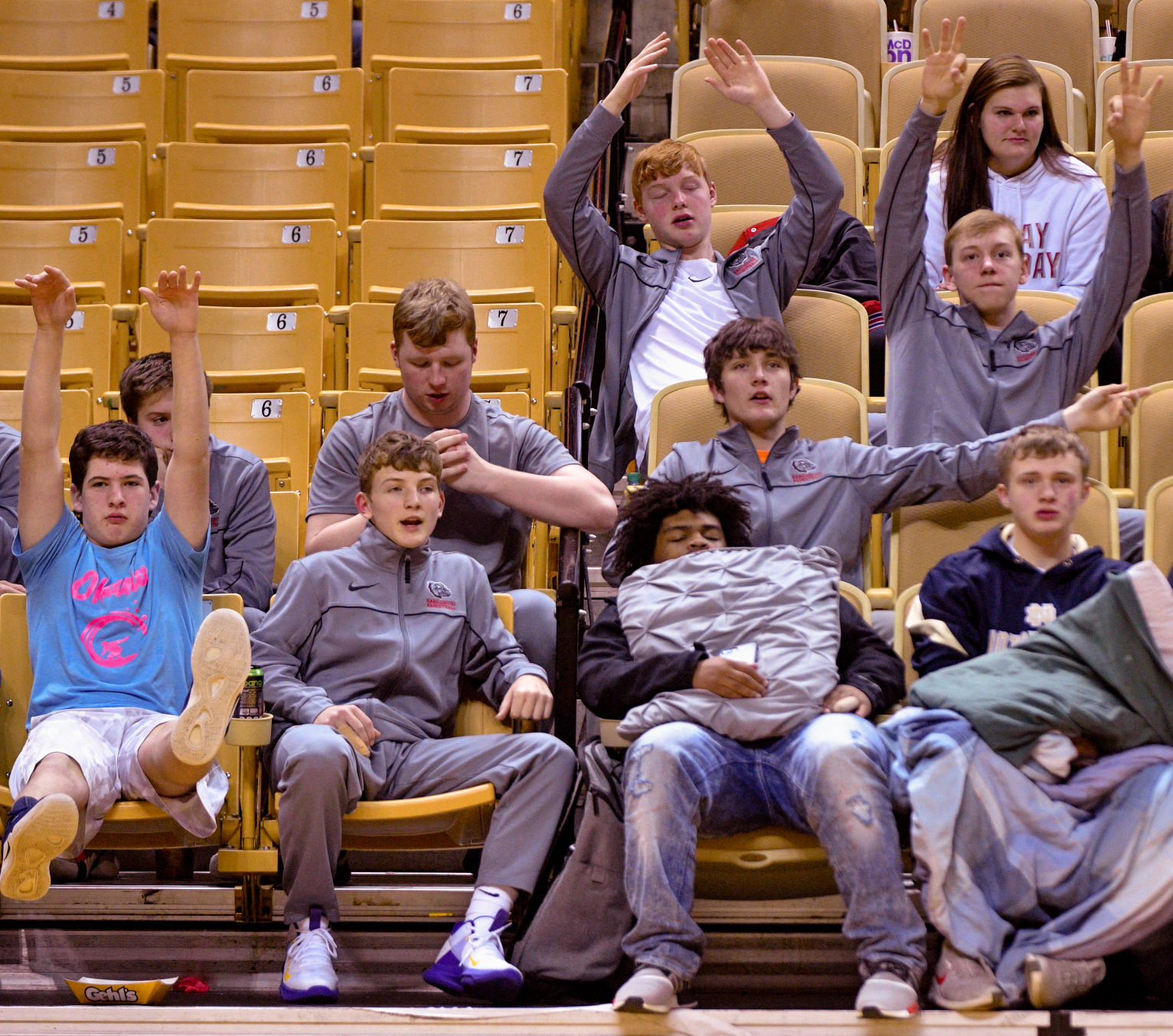 Delbert Harris, center, sleeps while students from Harrisburg High School